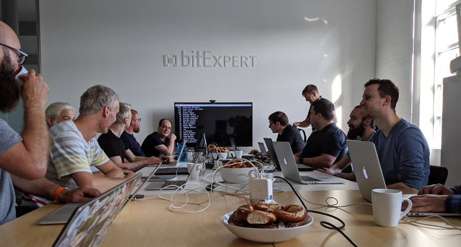 Photo of people working on PHPUnit, taken by Marco Pivetta